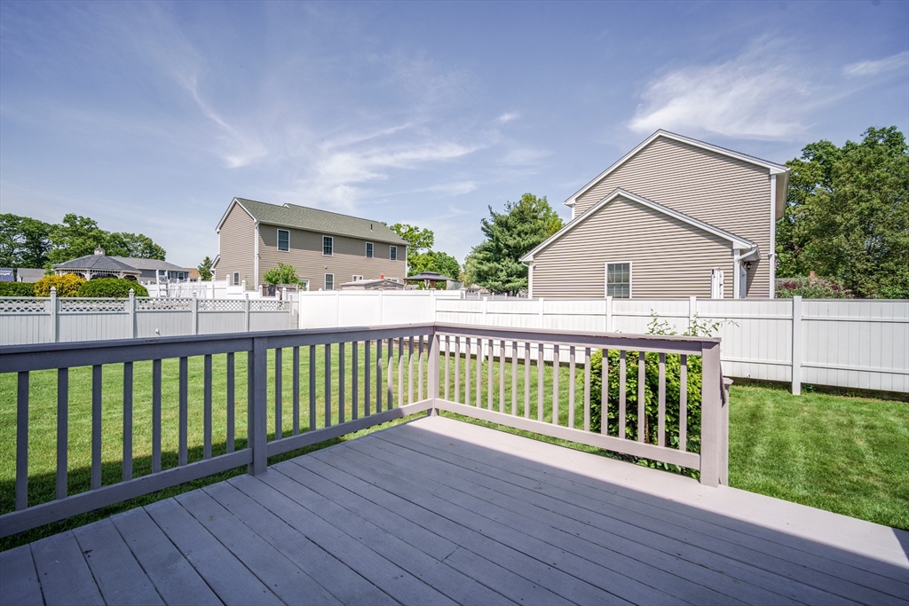 283 Christopher Drive Springfield, MA 01119 - Photo 28 of 32 a view of a wooden deck and a yard