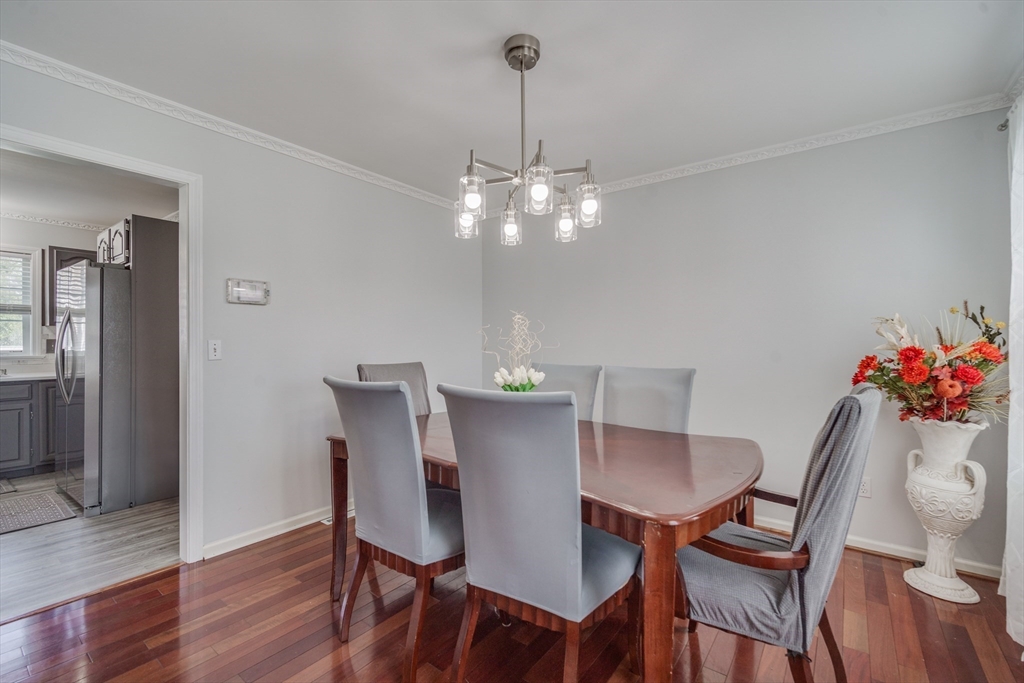 283 Christopher Drive Springfield, MA 01119 - Photo 9 of 32 a view of a dining room with furniture and wooden floor