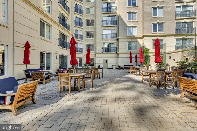 a view of a backyard with sitting area and entertaining space