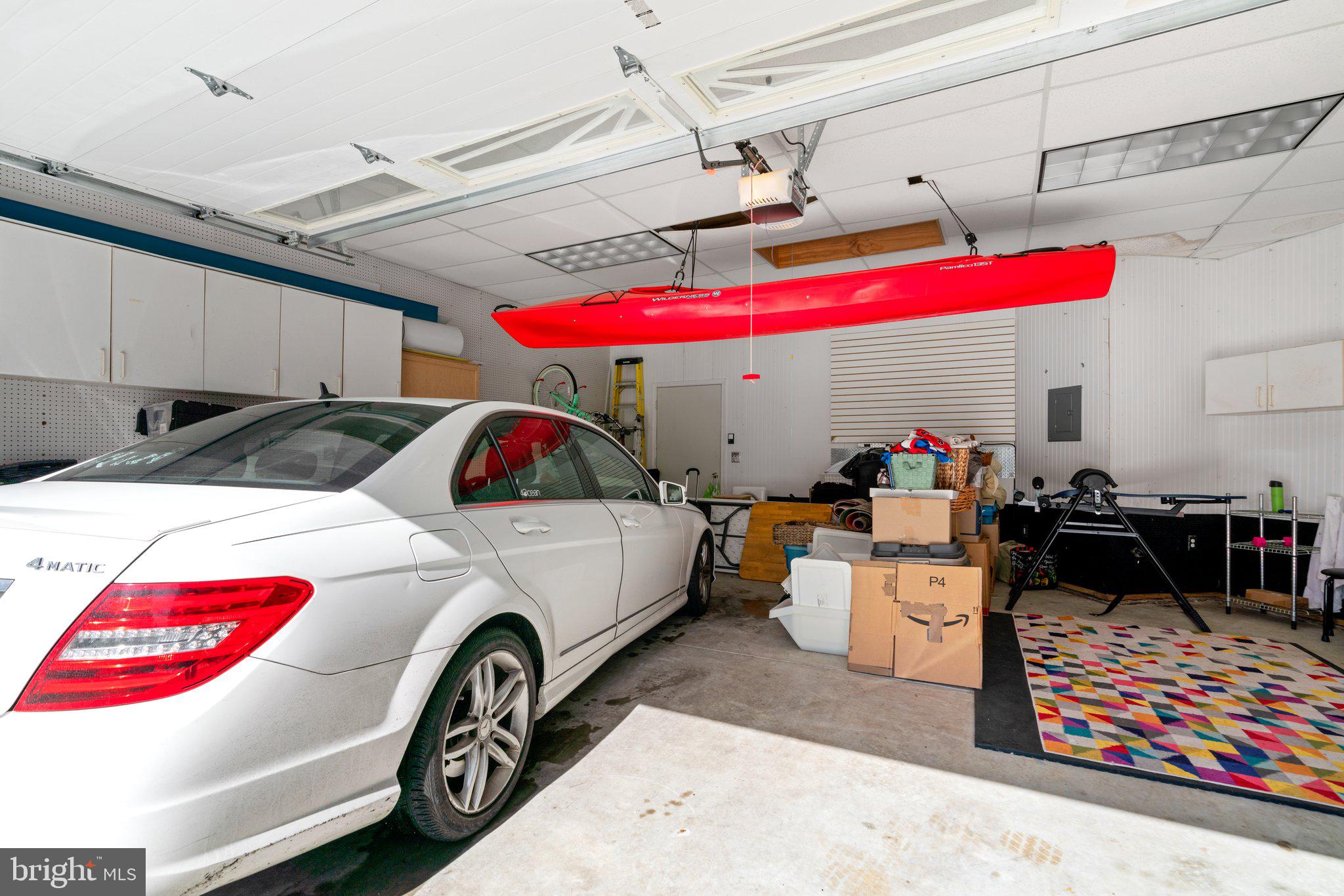 2401 Hayden Drive Silver Spring, MD 20902 - Photo 30 of 44 a car and bike parked in a garage