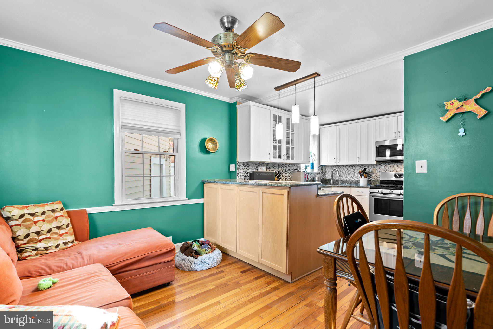 2401 Hayden Drive Silver Spring, MD 20902 - Photo 10 of 44 a living room with furniture and a window