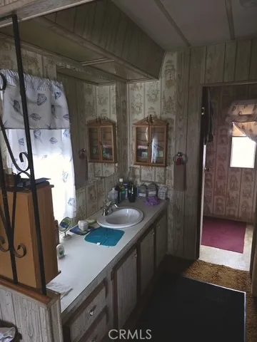 a kitchen with a sink and large window