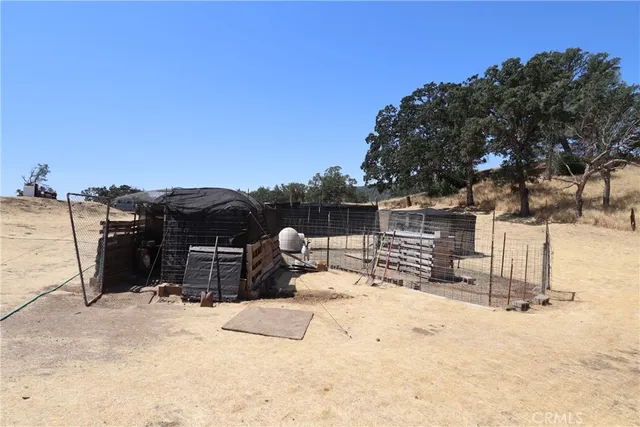 a view of roof covered with snow in the background