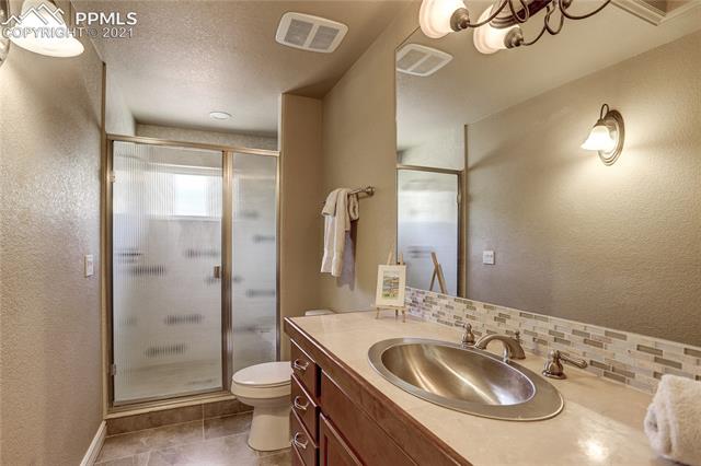 20 Keithley Road Manitou Springs, CO 80829 - Photo 24 of 42 Upper level, shared bathroom with walk-in shower.