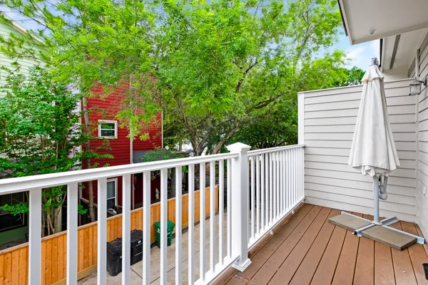 a view of a wooden chairs on the deck