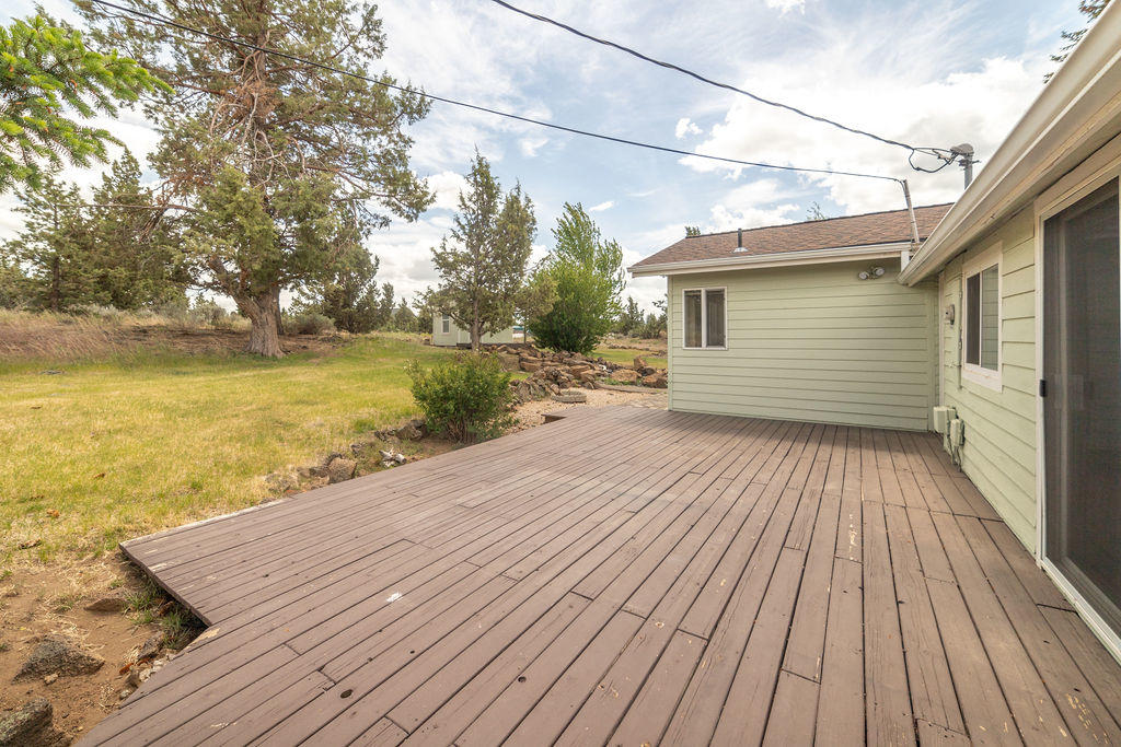 61395 Ward Road Bend, OR 97702 - Photo 40 of 56 a view of a wooden deck with a yard