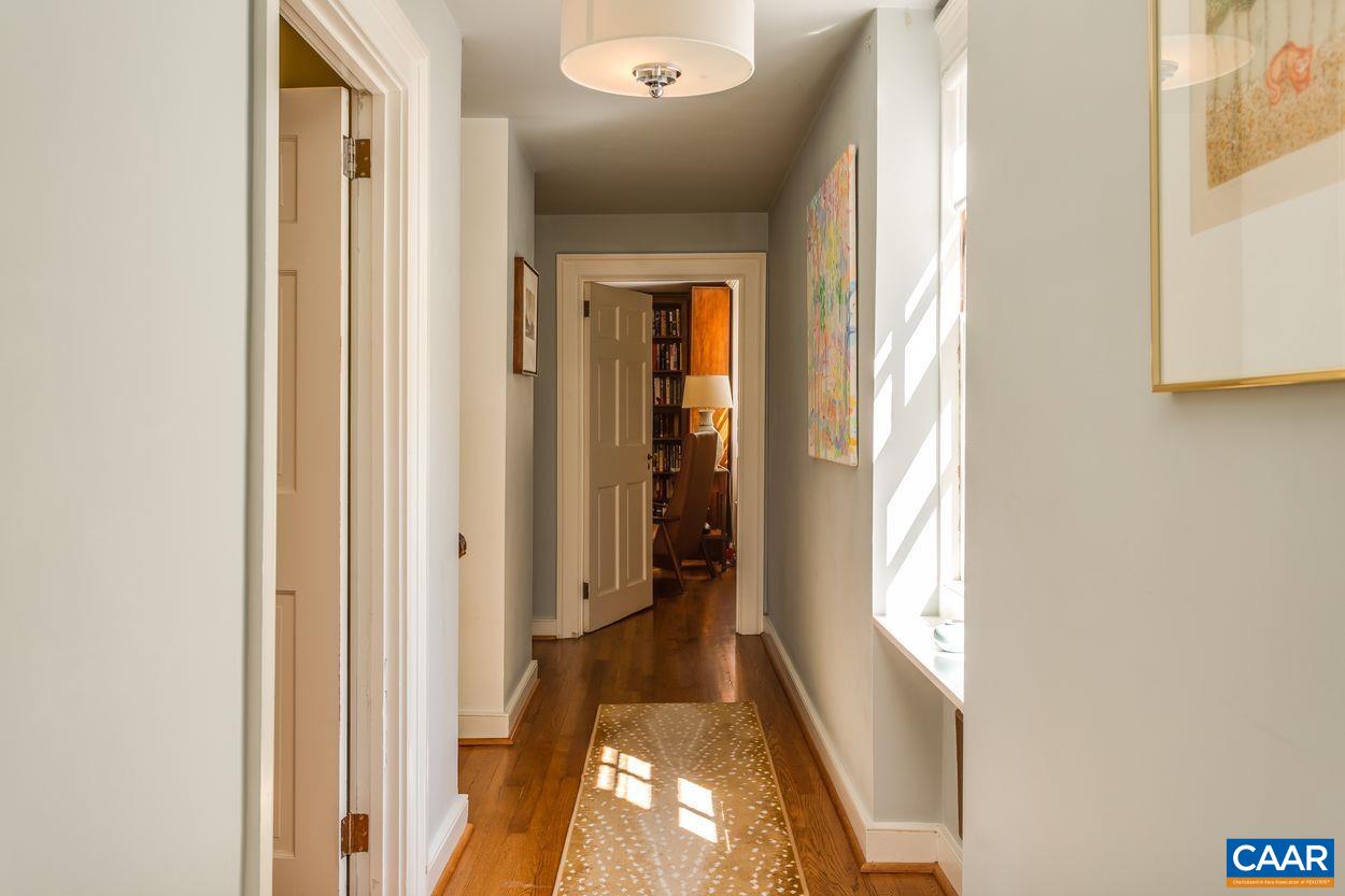 1310 Blue Ridge Road Charlottesville, VA 22903 - Photo 25 of 50 a view of a hallway with wooden floor and stairs
