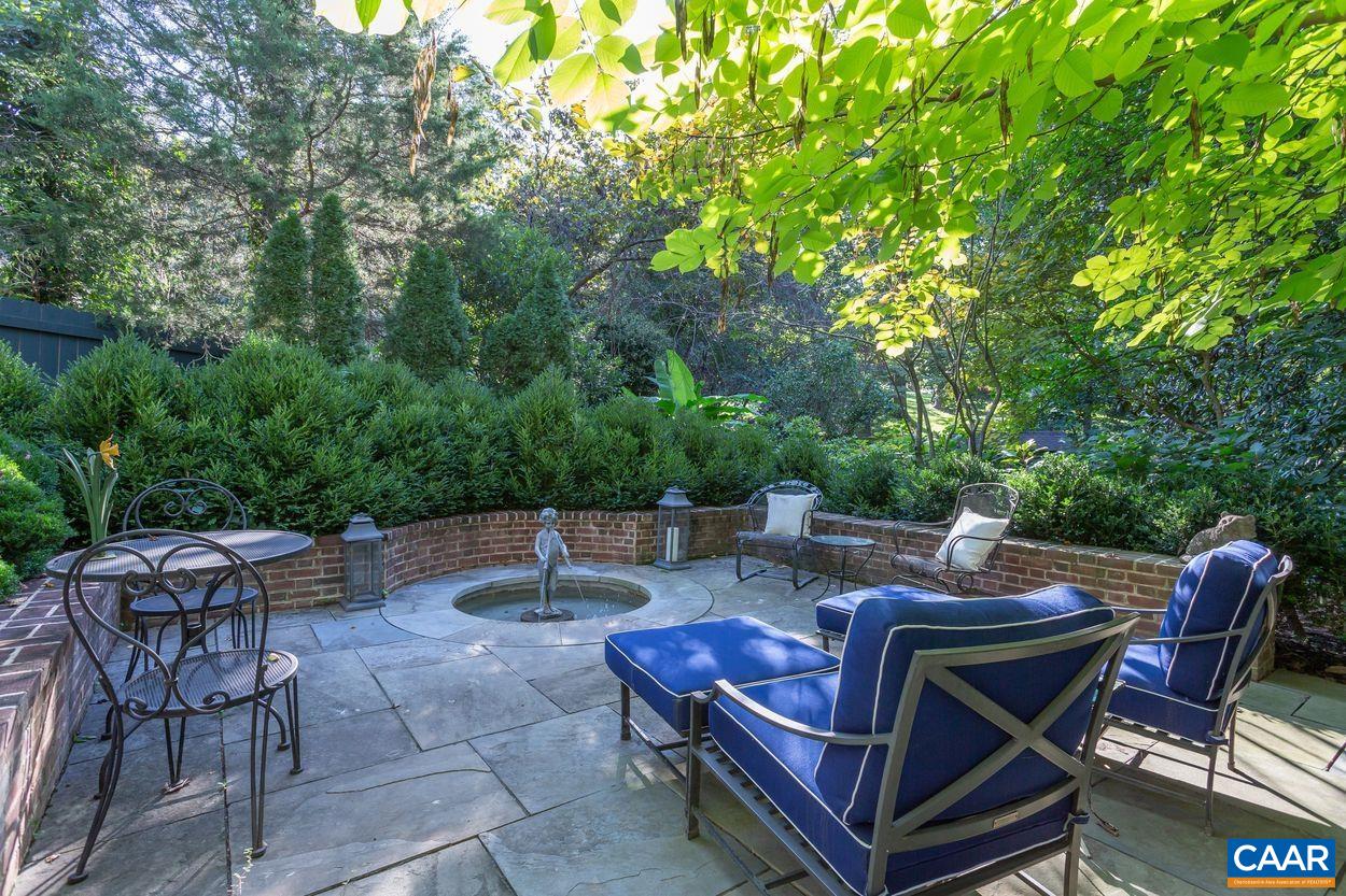 1310 Blue Ridge Road Charlottesville, VA 22903 - Photo 32 of 50 a view of a patio with a table and chairs