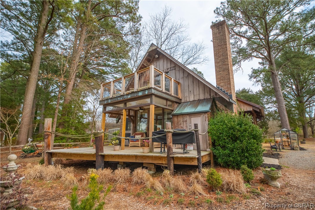 2515 Red Bank Road Gloucester, VA 23061 - Photo 3 of 49 Rear view of house featuring a wooden deck and a playground