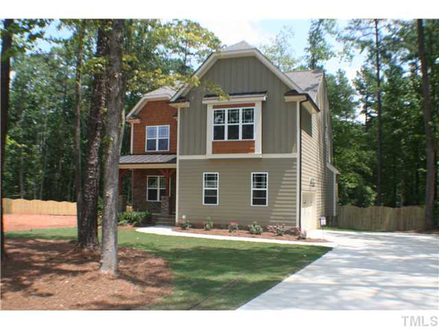 1400 Trinity Road, Unit LOT16 Cary, NC 27513 - Photo 1 of 25 a front view of a house with a yard