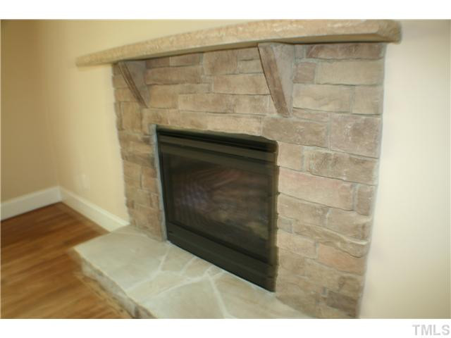 1400 Trinity Road, Unit LOT16 Cary, NC 27513 - Photo 18 of 25 a view of empty room with wooden floor and fireplace