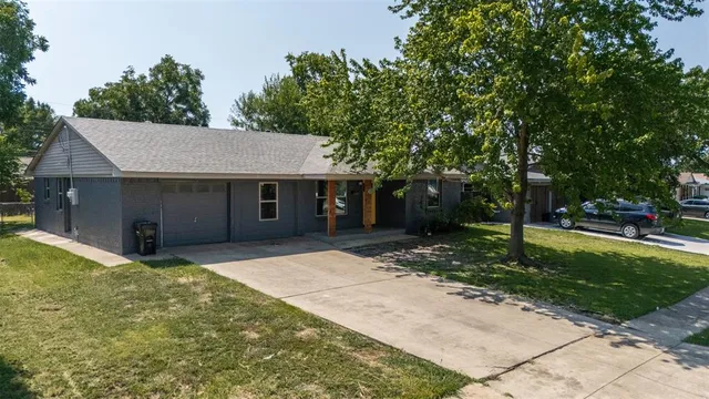 a house with trees in the background