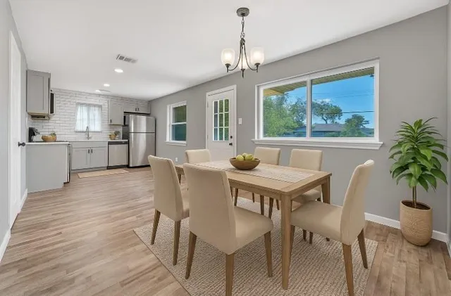 a view of a dining room with furniture window and outside view