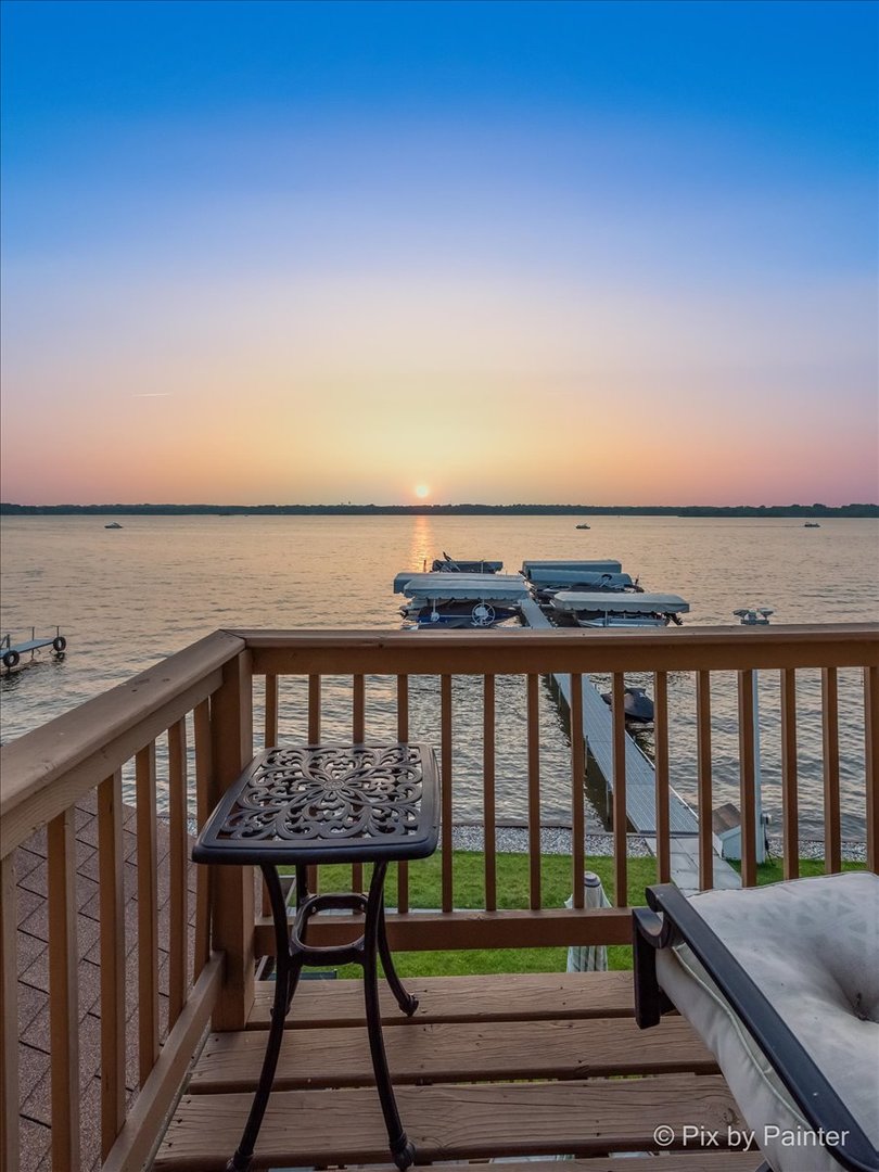 150 Eagle Point Road, Unit P Fox Lake, IL 60020 - Photo 8 of 33 a view of roof deck with two chairs and wooden floor