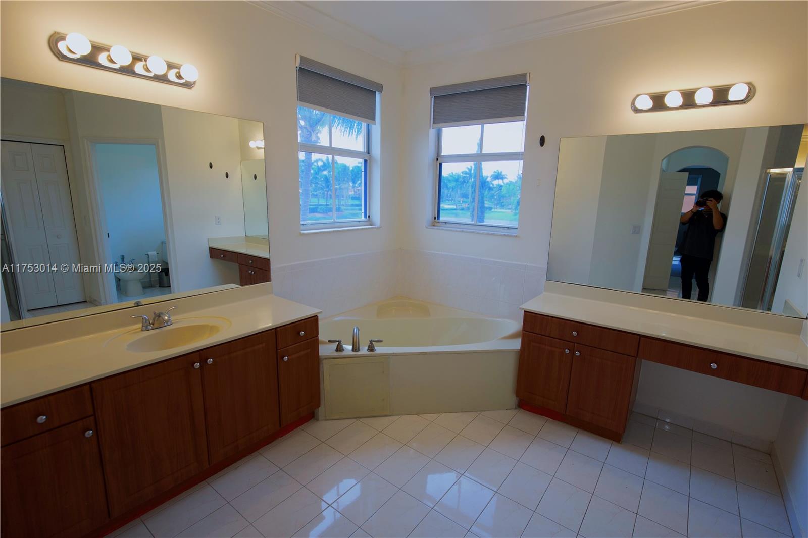 2631 Southwest 153rd Path, Unit 2631 Miami, FL 33185 - Photo 16 of 29 a spacious bathroom with a tub sink and mirror