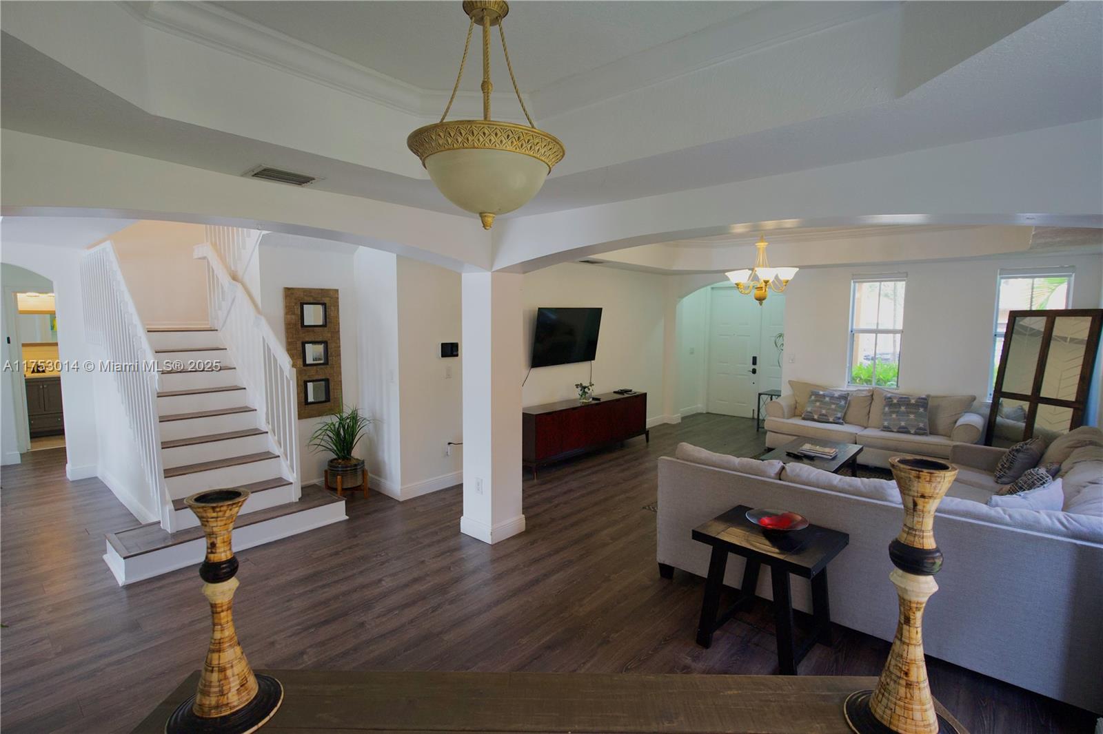 2631 Southwest 153rd Path, Unit 2631 Miami, FL 33185 - Photo 7 of 29 a living room with furniture and a wooden floor