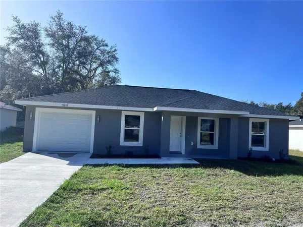 front view of a house with a yard