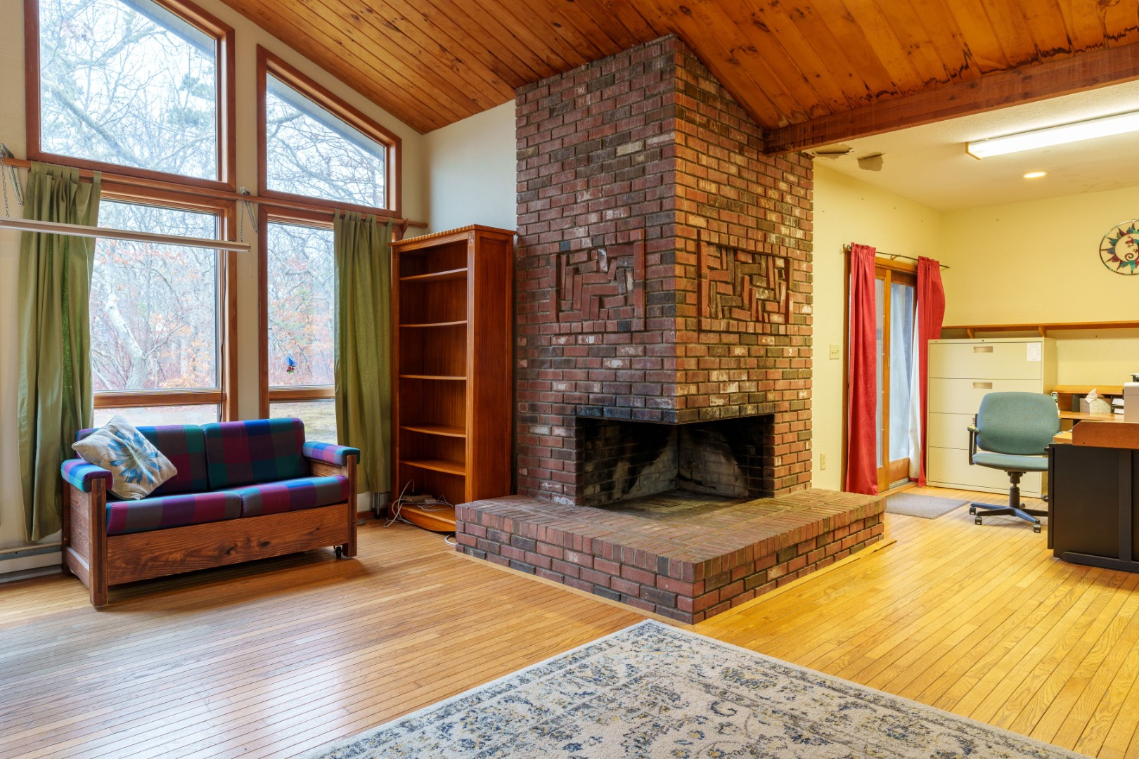 21 Llewellyn Way Edgartown, MA 02539 - Photo 11 of 34 a living room with furniture a bed and a fireplace