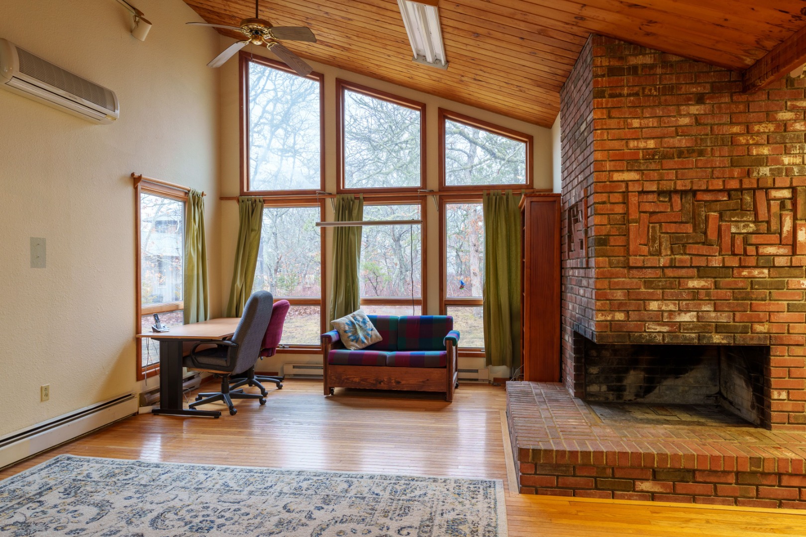 21 Llewellyn Way Edgartown, MA 02539 - Photo 13 of 34 a living room with furniture and a fireplace