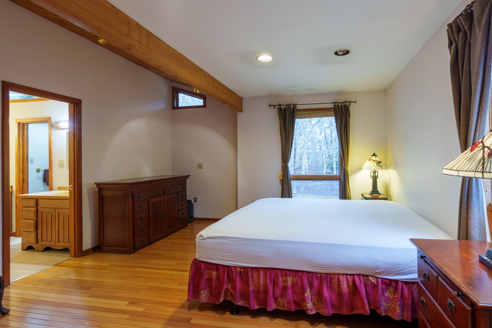 21 Llewellyn Way Edgartown, MA 02539 - Photo 23 of 34 a bedroom with a bed and a dresser with wooden floor