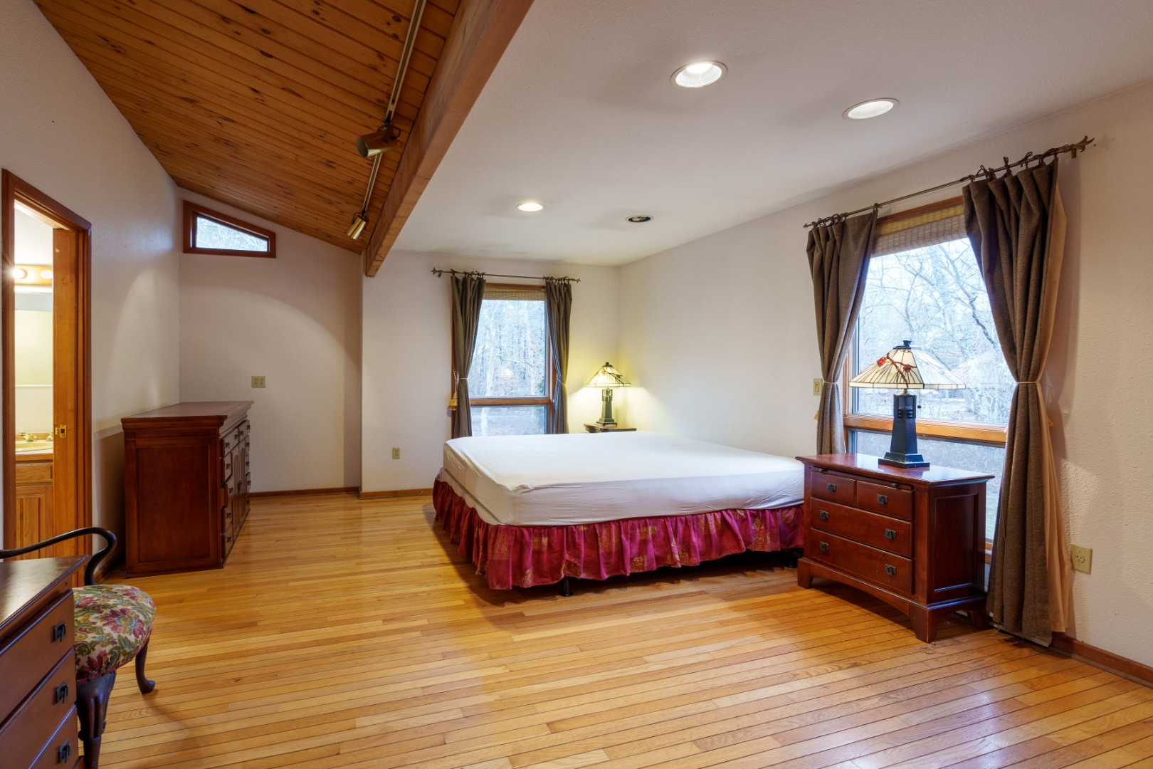 21 Llewellyn Way Edgartown, MA 02539 - Photo 24 of 34 a bedroom with a bed and wooden floor