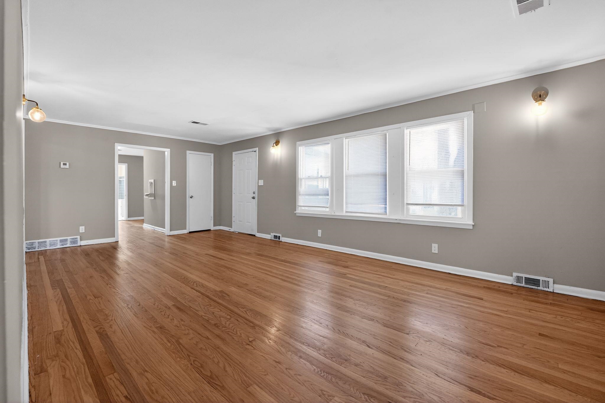 4094 Auburn Road Memphis, TN 38116 - Photo 9 of 30 Unfurnished living room featuring wood finished floors and ornamental molding