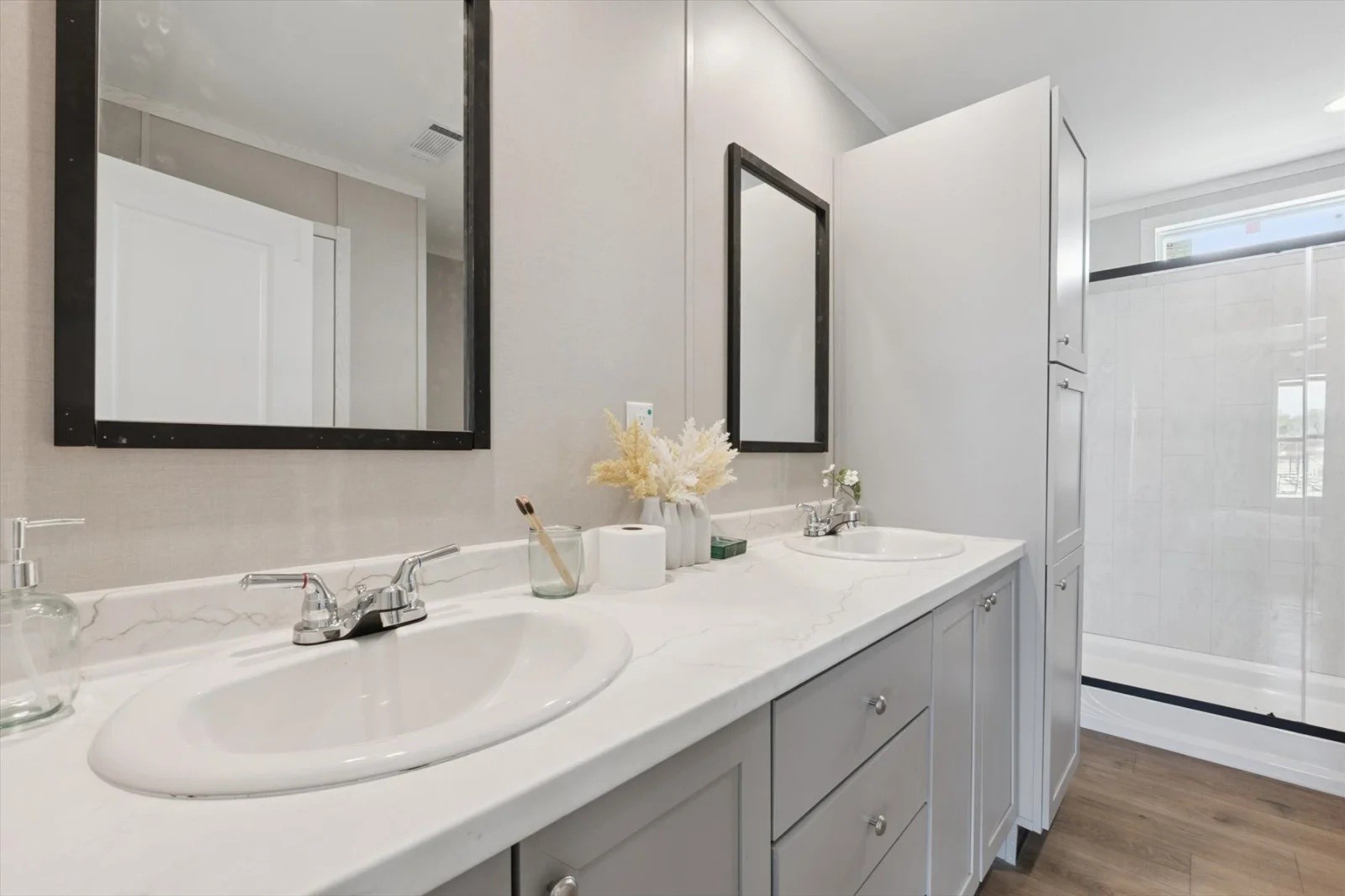 243 County Road 3662 Splendora, TX 77372 - Photo 4 of 8 a bathroom with double sink and a mirror