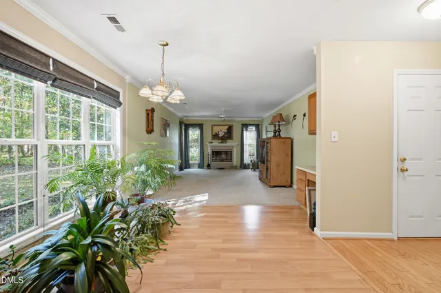 a view of a room with furniture and a window