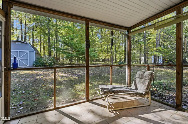 an aerial view of a house with outdoor space and street view