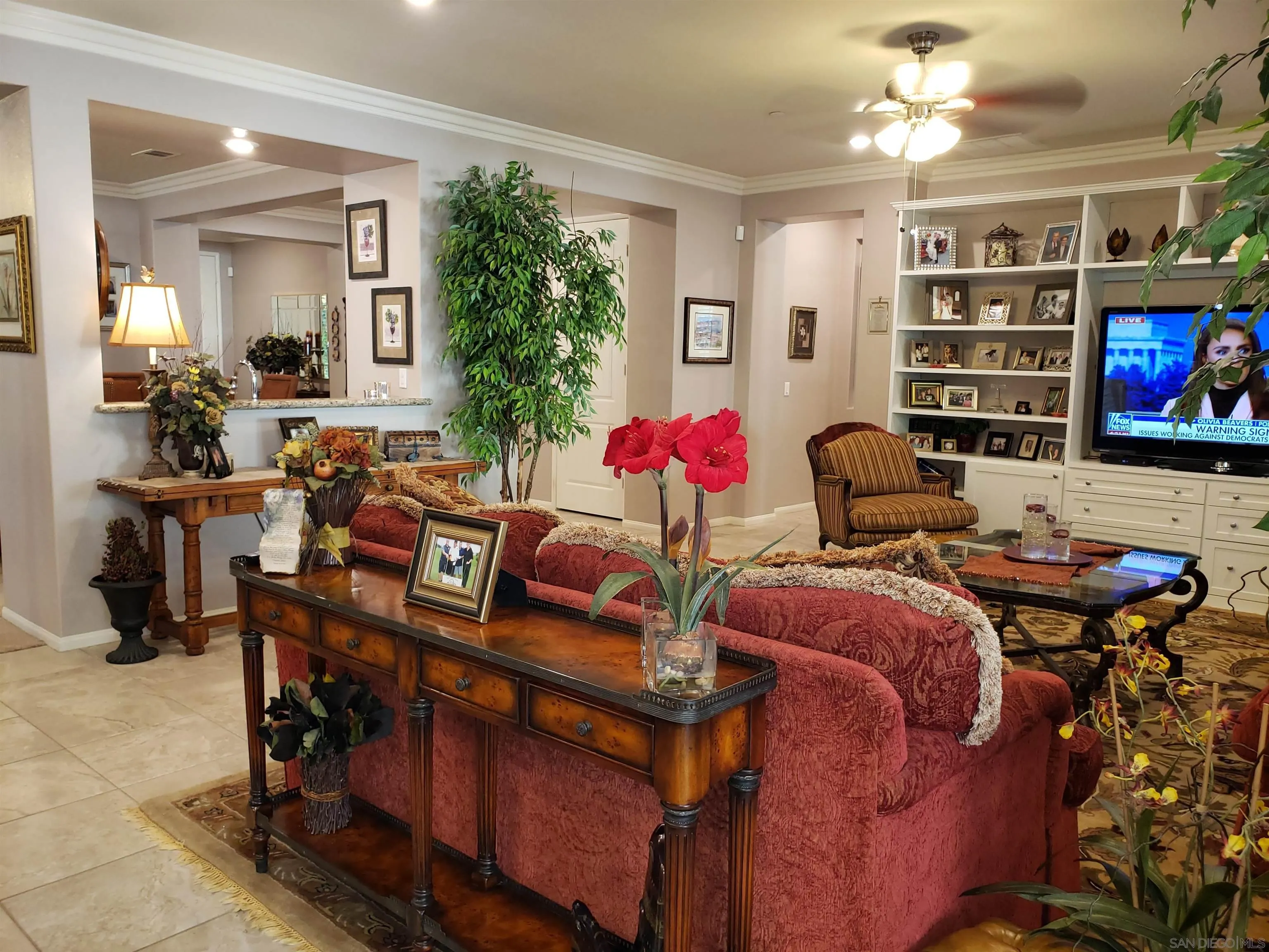 1624 Paseo Diamonte Hemet, CA 92545 - Photo 12 of 35 a living room with furniture and a flat screen tv
