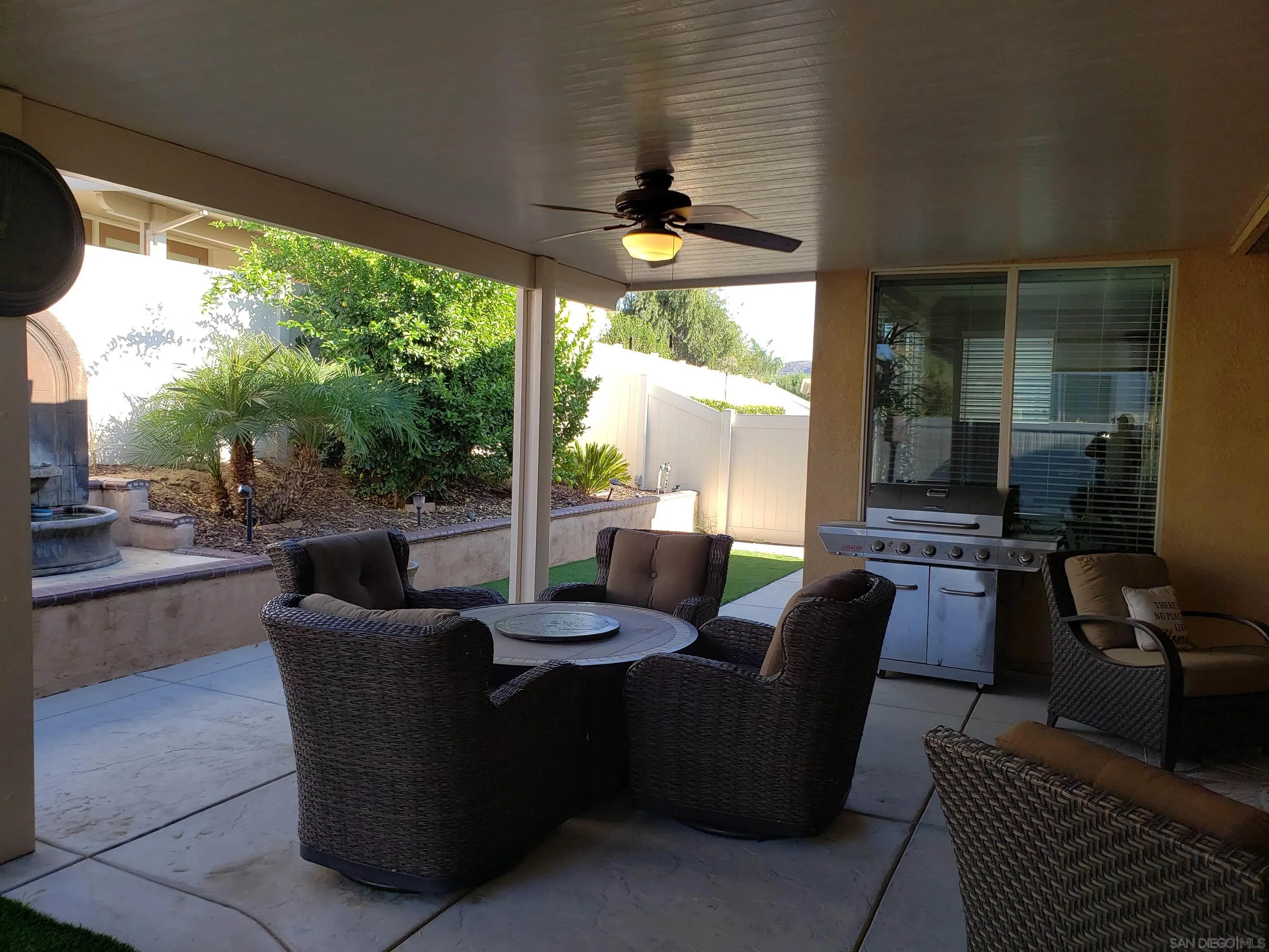 1624 Paseo Diamonte Hemet, CA 92545 - Photo 23 of 35 a living room with patio furniture and a floor to ceiling window