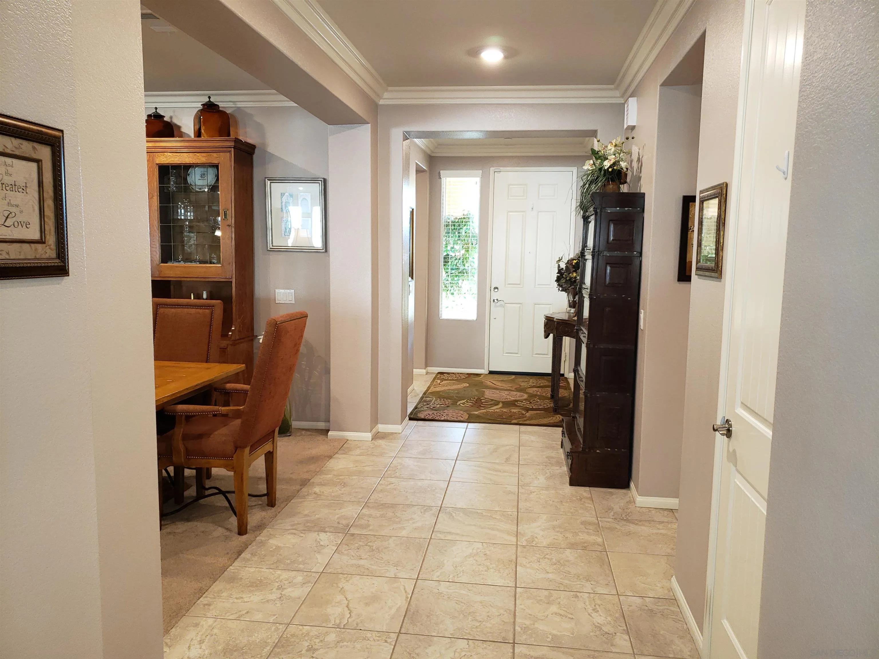1624 Paseo Diamonte Hemet, CA 92545 - Photo 3 of 35 a view of a hallway with workspace and a window