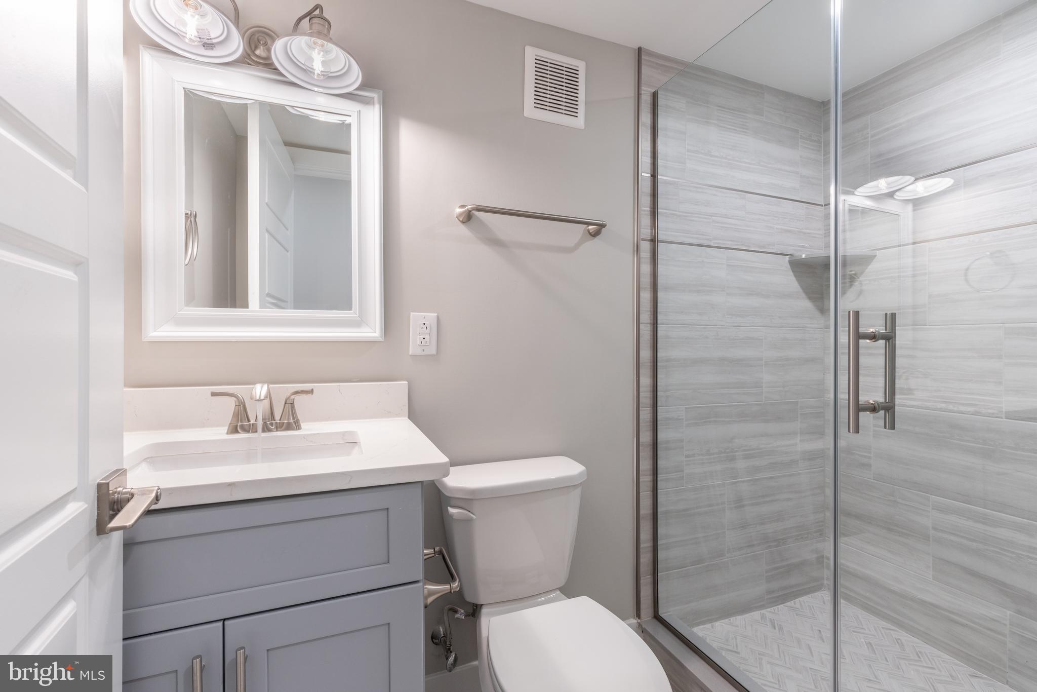 141 West Huntingdon Street, Unit 1 Philadelphia, PA 19133 - Photo 12 of 21 a bathroom with a sink toilet and shower
