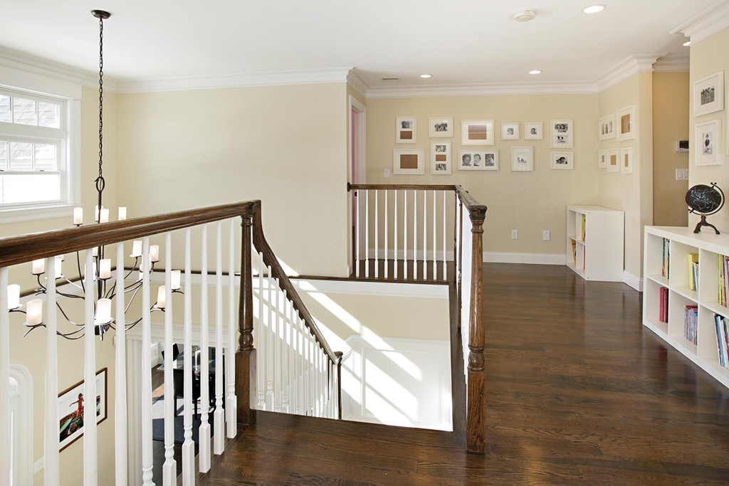25 Marthas Lane Brookline, MA 02467 - Photo 6 of 10 a view of a hallway with wooden floor and entryway