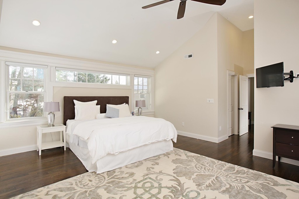25 Marthas Lane Brookline, MA 02467 - Photo 7 of 10 a bedroom with a large bed and a tv