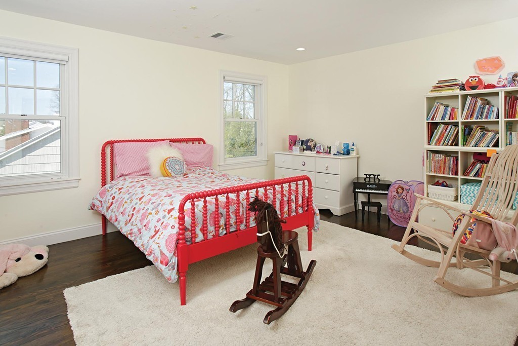 25 Marthas Lane Brookline, MA 02467 - Photo 9 of 10 a bedroom with a bed and a book shelf