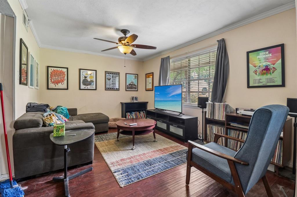 820 North Bowen Road Arlington, TX 76012 - Photo 11 of 40 a living room with furniture a rug and a window