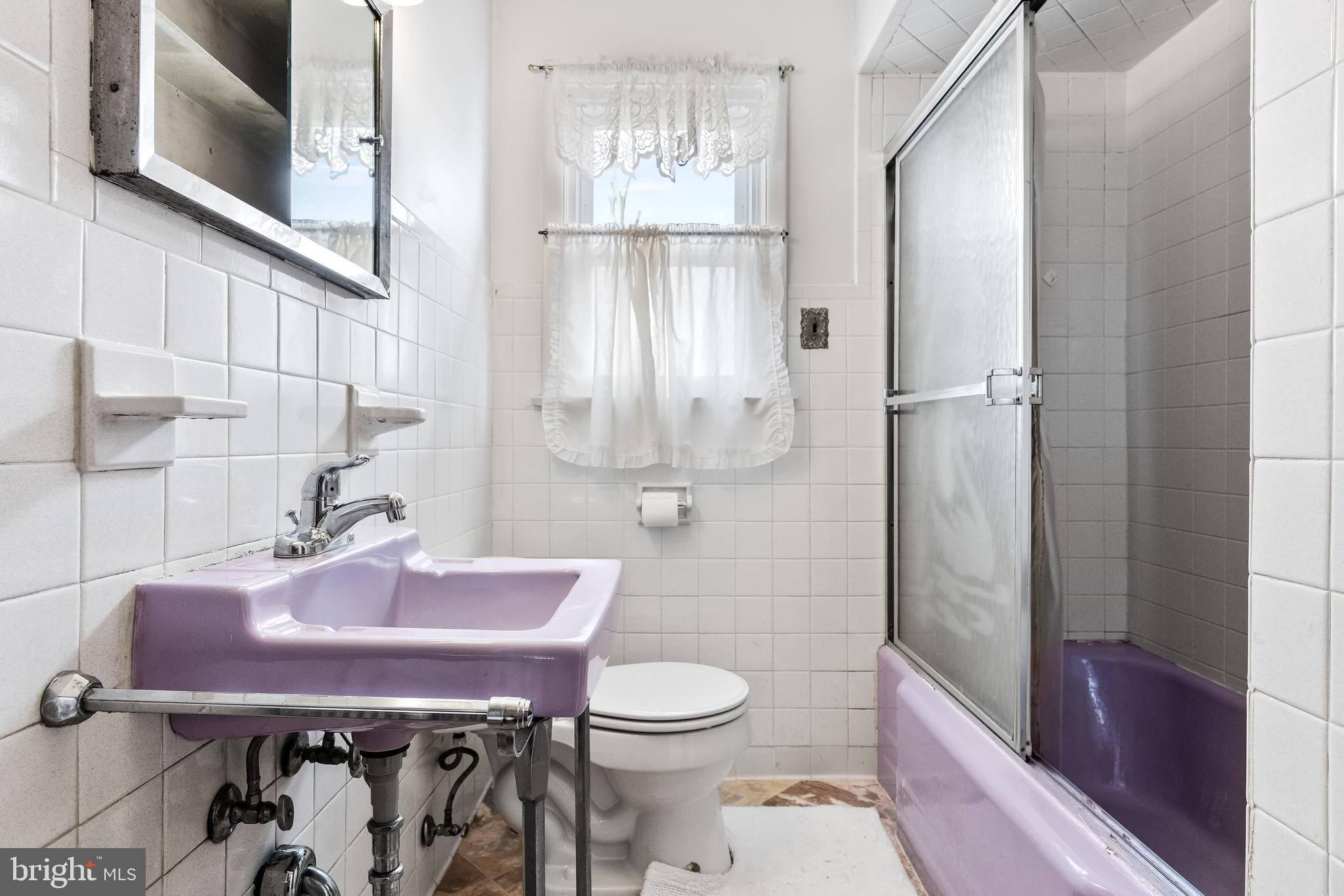 313 West Evesham Road Runnemede, NJ 08078 - Photo 17 of 34 a bathroom with a sink a toilet and shower