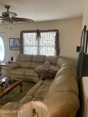 a living room with furniture and a window