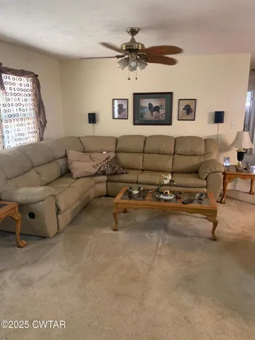 a living room with furniture and a window