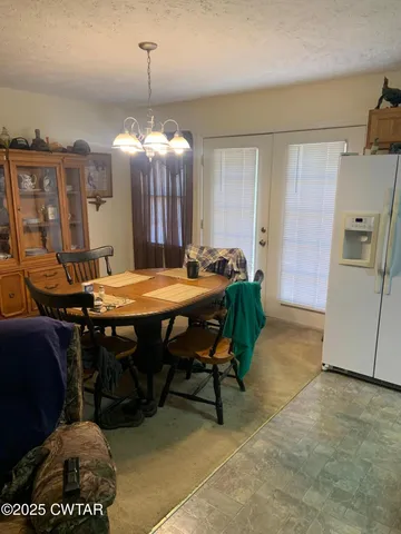 a bedroom with a bed and a night stand