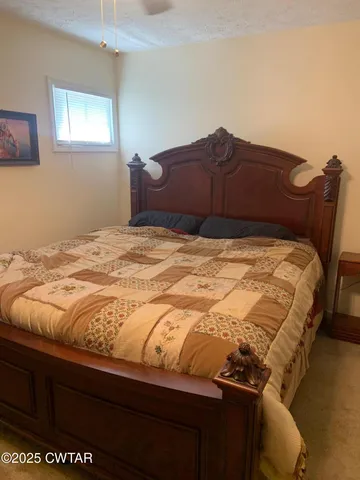 a bedroom with a bed and a closet