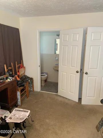 a view of a livingroom from a hallway