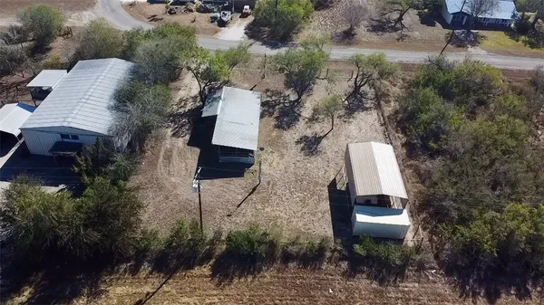 an aerial view of a house with outdoor space
