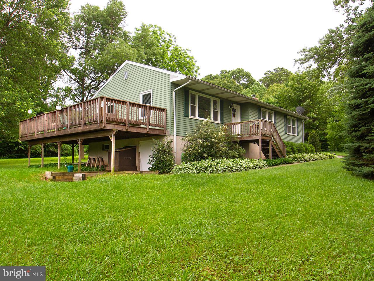 17521 Troyer Road Monkton, MD 21111 - Photo 1 of 29 a front view of a house with a garden