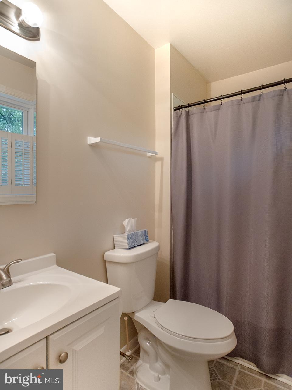 17521 Troyer Road Monkton, MD 21111 - Photo 12 of 29 a white toilet sitting next to a bathroom sink