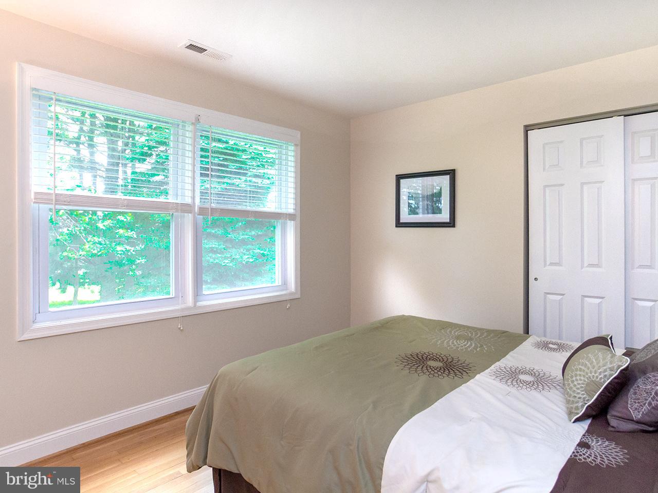 17521 Troyer Road Monkton, MD 21111 - Photo 13 of 29 a bedroom with a bed and wooden floor