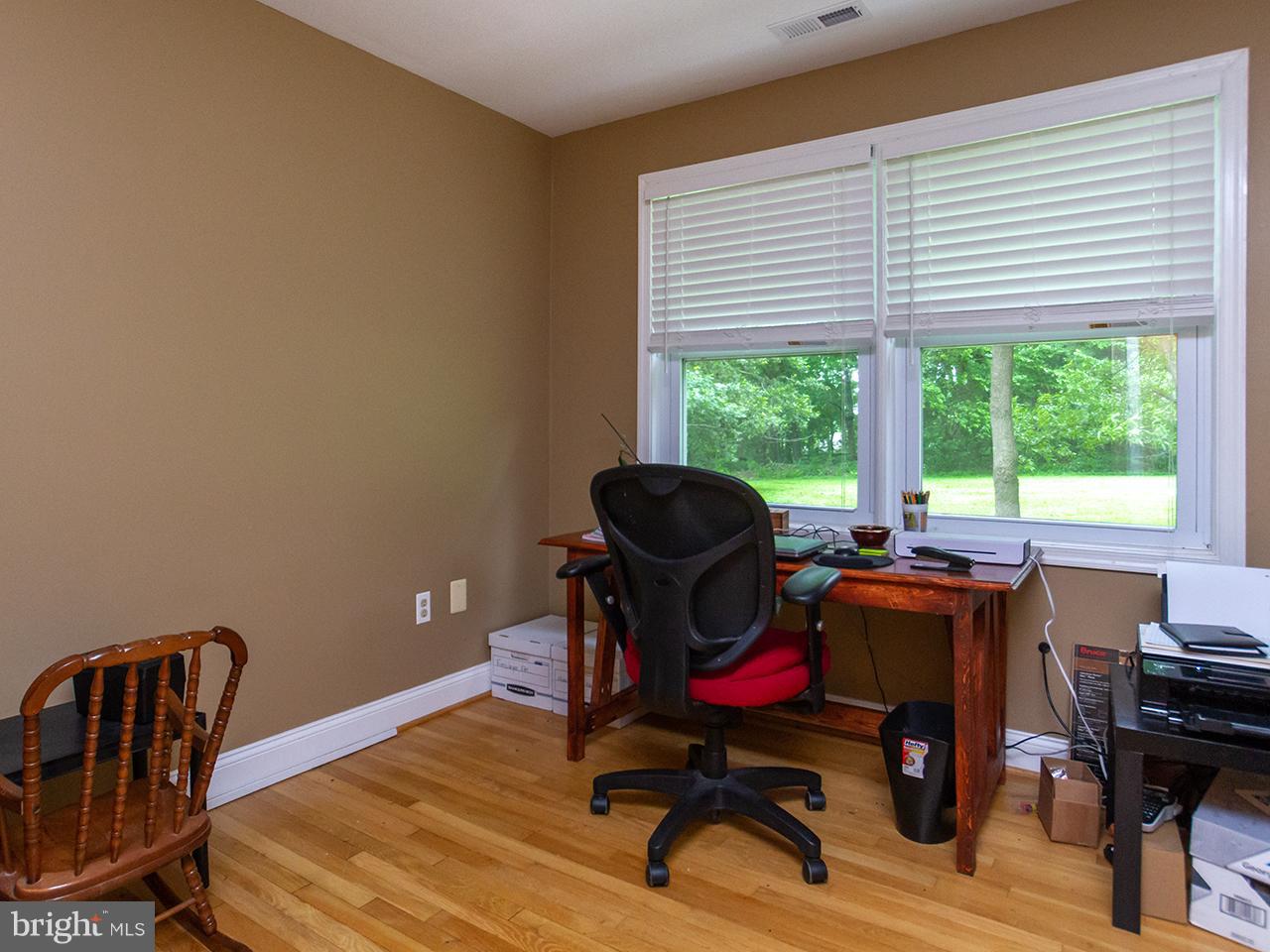 17521 Troyer Road Monkton, MD 21111 - Photo 16 of 29 a view of a workspace with furniture and a window