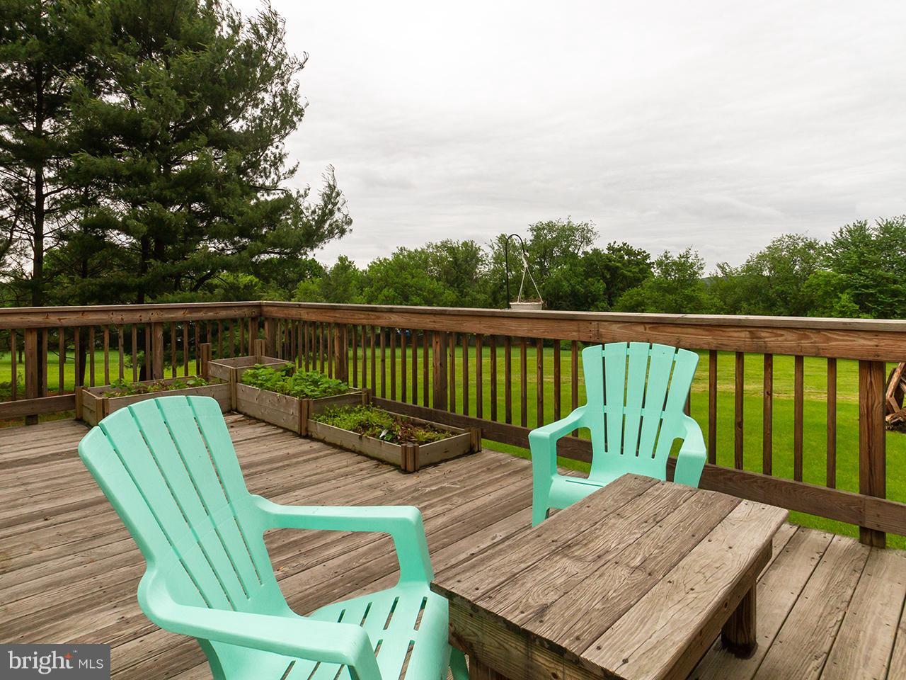 17521 Troyer Road Monkton, MD 21111 - Photo 4 of 29 a view of balcony with wooden floor and outdoor seating