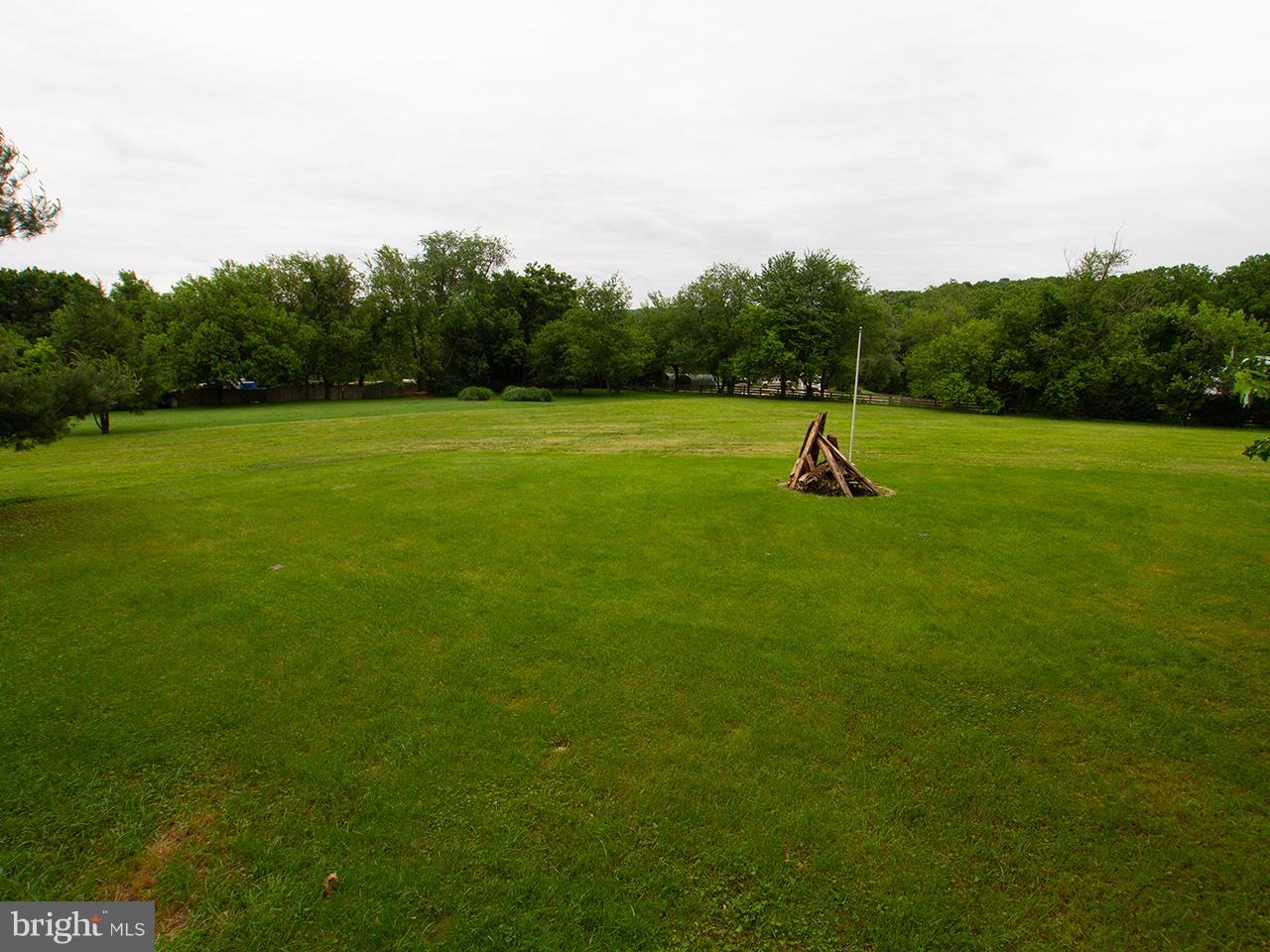 17521 Troyer Road Monkton, MD 21111 - Photo 5 of 29 a view of a green field with wooden fence